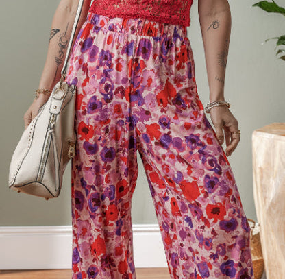 Pantaloni cu talie înaltă și imprimeu floral vibrant de Cristina Gore